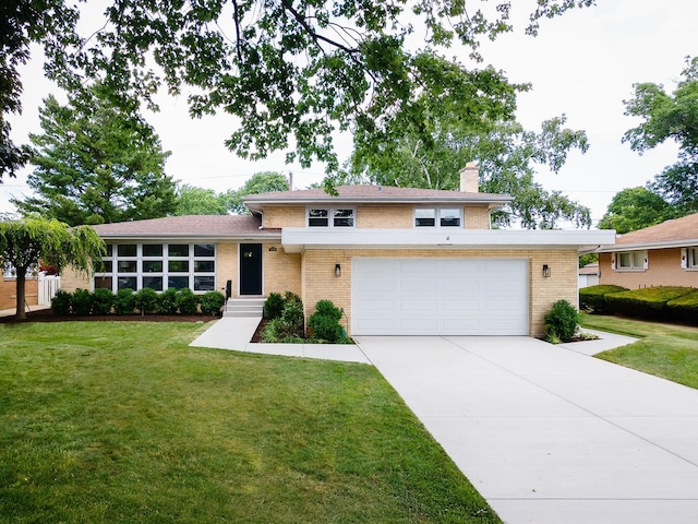 5028 Coyle Ave, Skokie, IL 60077 - split level home featuring brick siding, driveway, a front yard, and a chimney