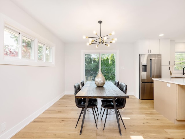 5028 Coyle Ave, Skokie, IL 60077 - dining area with a chandelier, light wood finished floors, healthy amount of natural light, and recessed lighting