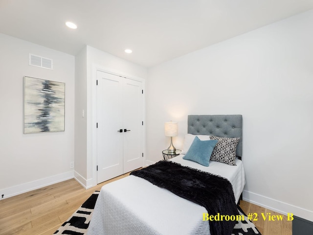 5028 Coyle Ave, Skokie, IL 60077 - bedroom with light wood-type flooring, recessed lighting, and a closet