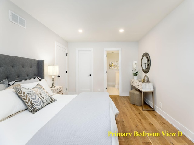 5028 Coyle Ave, Skokie, IL 60077 - bedroom with light wood-type flooring, recessed lighting, and connected bathroom