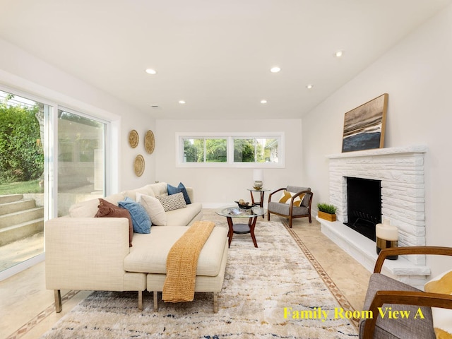 5028 Coyle Ave, Skokie, IL 60077 - living room with inlaid floor details, recessed lighting, and a stone fireplace