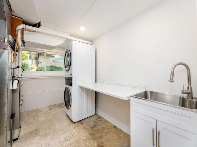 5028 Coyle Ave, Skokie, IL 60077 - laundry area with estacked washer and dryer, recessed lighting, and stone finish flooring