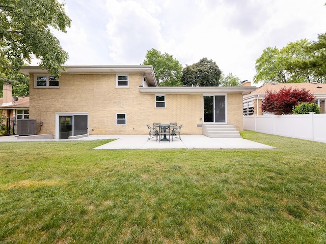 5028 Coyle Ave, Skokie, IL 60077 - rear view of property with entry steps, a patio, and brick siding