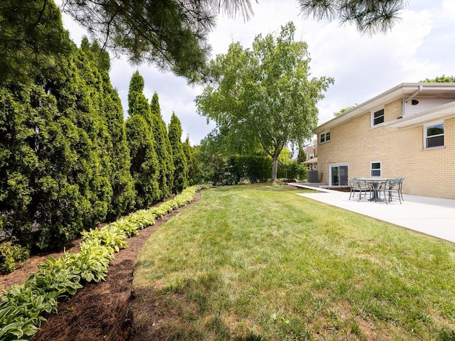 5028 Coyle Ave, Skokie, IL 60077 - view of grassy yard featuring a patio