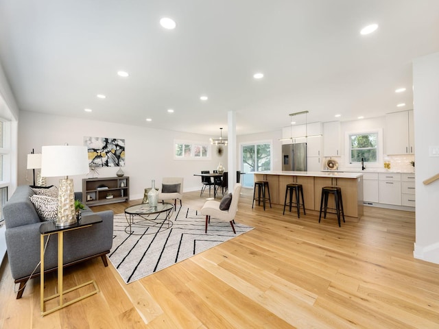 5028 Coyle Ave, Skokie, IL 60077 - living area with light wood-style floors and recessed lighting