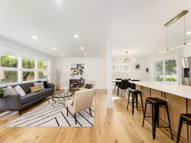 5028 Coyle Ave, Skokie, IL 60077 - living area with a chandelier, light wood-type flooring, and recessed lighting