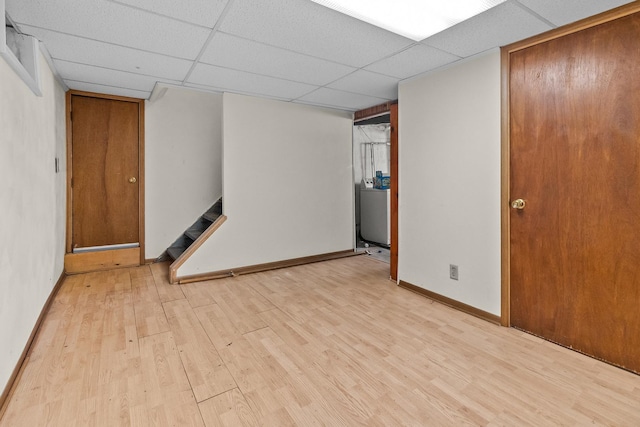 2911 Preston St, Rockford, IL 61102 - unfurnished room featuring light wood-type flooring, a paneled ceiling, and stairway