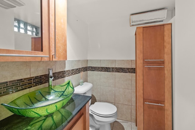 2911 Preston St, Rockford, IL 61102 - half bathroom featuring vanity, tile walls, tile patterned floors, and wainscoting