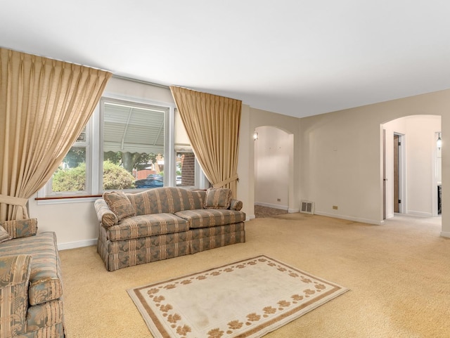 2443 S 4th Ave, North Riverside, IL 60546 - living room featuring arched walkways and carpet floors