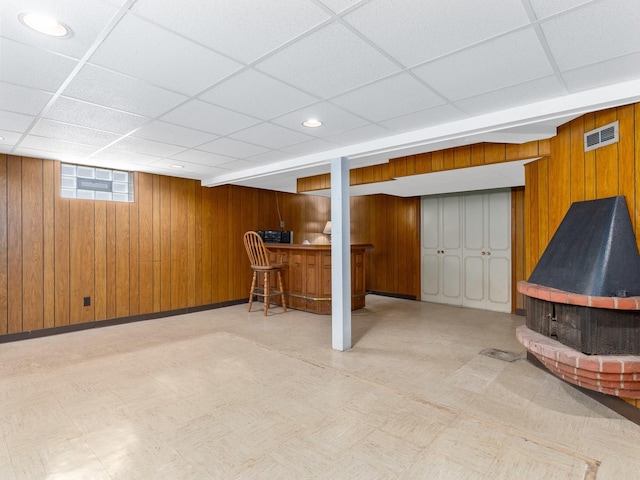 2443 S 4th Ave, North Riverside, IL 60546 - basement with a drop ceiling, wooden walls, bar, and tile patterned floors
