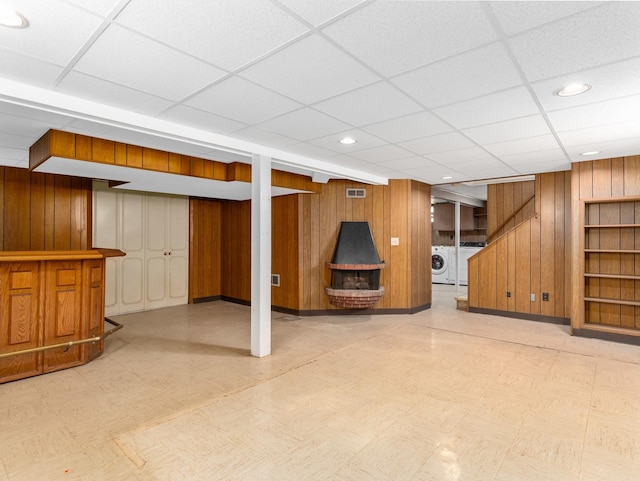 2443 S 4th Ave, North Riverside, IL 60546 - finished basement featuring tile patterned floors, wooden walls, separate washer and dryer, a drop ceiling, and a dry bar