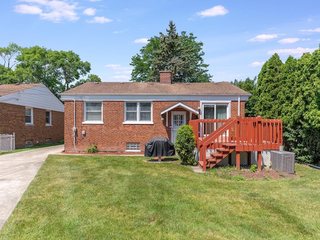 2443 S 4th Ave, North Riverside, IL 60546 - view of front of property featuring brick siding, a chimney, a front lawn, and a wooden deck