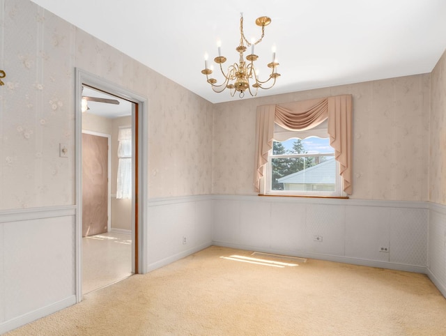 2443 S 4th Ave, North Riverside, IL 60546 - carpeted empty room featuring a chandelier, wainscoting, and wallpapered walls