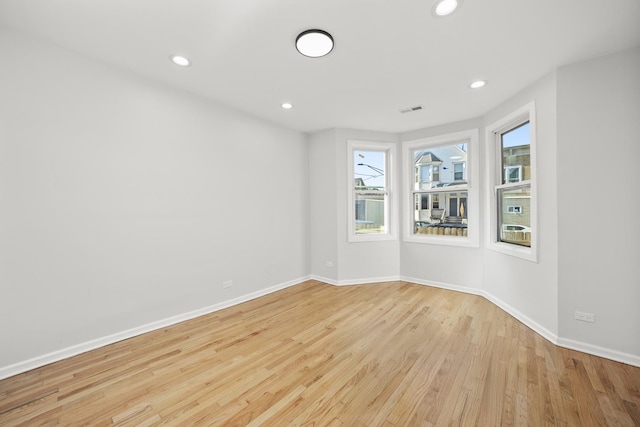 712 W 48th Pl, Chicago, IL 60609 - empty room with light wood-type flooring and recessed lighting