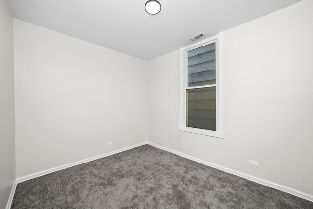712 W 48th Pl, Chicago, IL 60609 - unfurnished room with baseboards and dark colored carpet