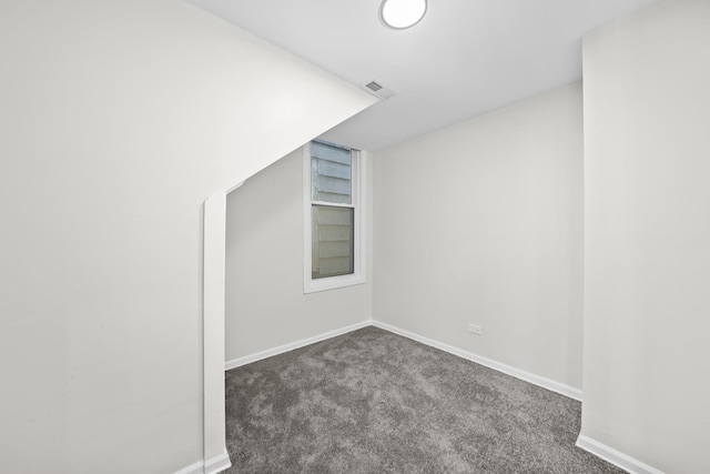 712 W 48th Pl, Chicago, IL 60609 - unfurnished room with dark colored carpet and baseboards