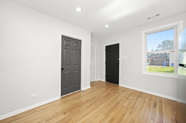712 W 48th Pl, Chicago, IL 60609 - unfurnished room with light wood finished floors and recessed lighting