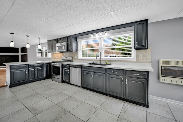 12247 S Avers Ave, Alsip, IL 60803 - kitchen with appliances with stainless steel finishes, heating unit, a peninsula, a paneled ceiling, and tasteful backsplash