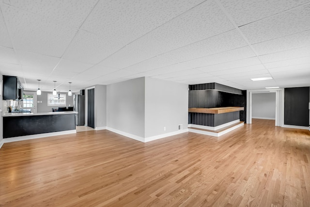 12247 S Avers Ave, Alsip, IL 60803 - unfurnished living room with a drop ceiling and light wood-style floors
