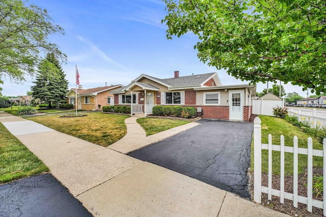 12247 S Avers Ave, Alsip, IL 60803 - single story home featuring brick siding, a porch, and a chimney