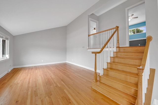 12247 S Avers Ave, Alsip, IL 60803 - staircase with ceiling fan, wood finished floors, and vaulted ceiling