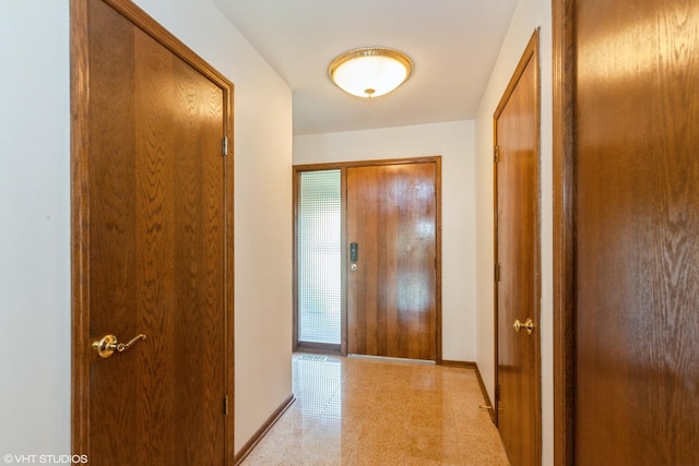 134 Country Club Dr, Bloomingdale, IL 60108 - corridor with baseboards and dark aggregate flooring