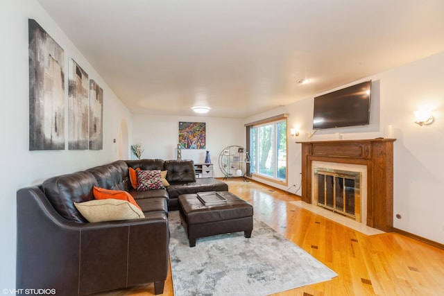 134 Country Club Dr, Bloomingdale, IL 60108 - living room with wood finished floors and a fireplace with flush hearth