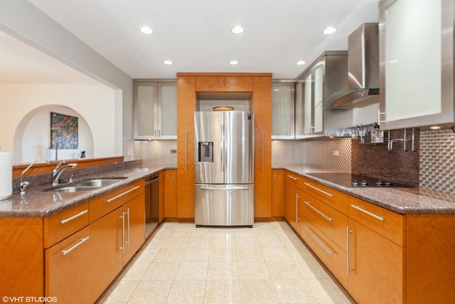 134 Country Club Dr, Bloomingdale, IL 60108 - kitchen with appliances with stainless steel finishes, wall chimney range hood, dark stone countertops, recessed lighting, and tasteful backsplash