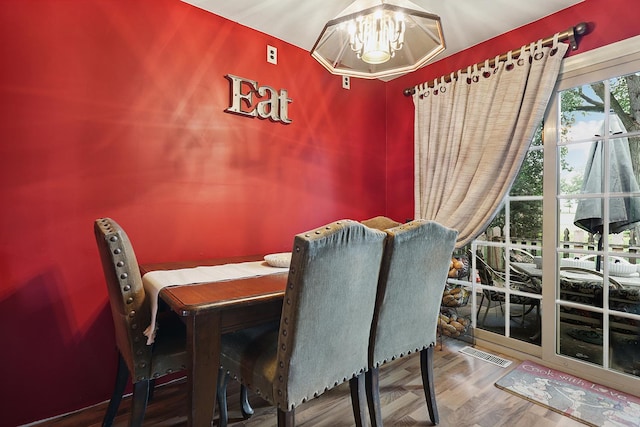 13420 Florence Rd, Mokena, IL 60448 - dining space featuring a chandelier and wood finished floors