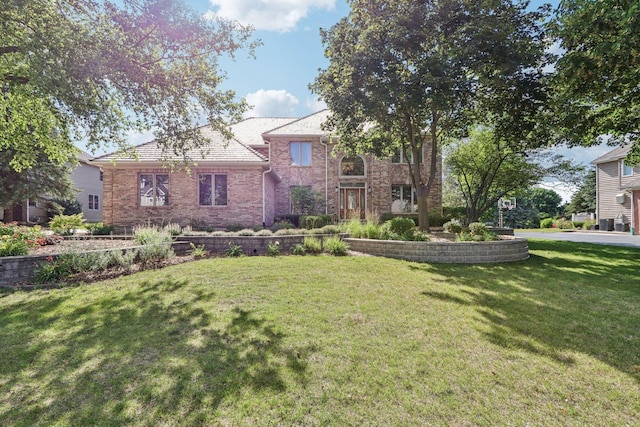 641 Mason Ln, Lake In The Hills, IL 60156 - view of front of property with a front yard and brick siding
