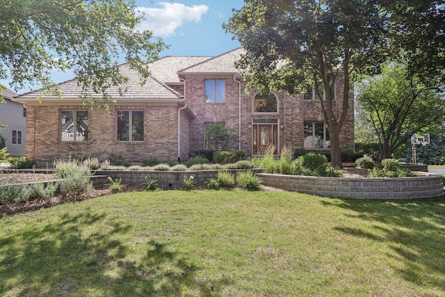 641 Mason Ln, Lake In The Hills, IL 60156 - view of front facade featuring a front lawn and brick siding