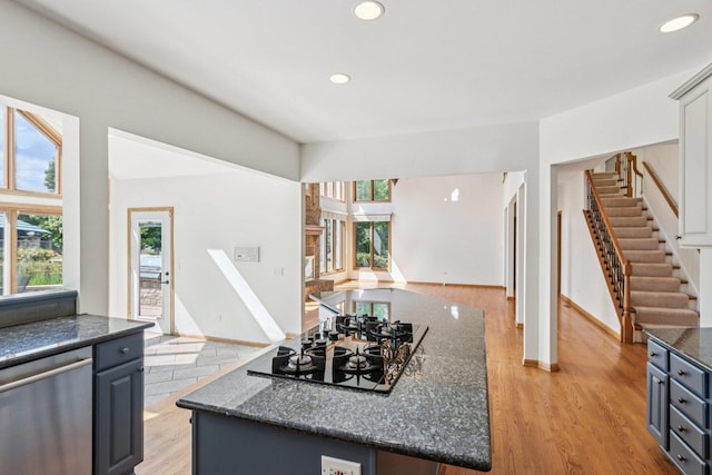 641 Mason Ln, Lake In The Hills, IL 60156 - kitchen featuring dishwasher, light wood finished floors, dark stone countertops, recessed lighting, and gas cooktop