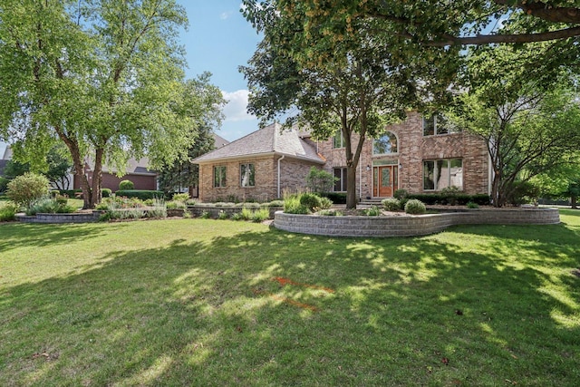 641 Mason Ln, Lake In The Hills, IL 60156 - view of front facade featuring a front yard and brick siding
