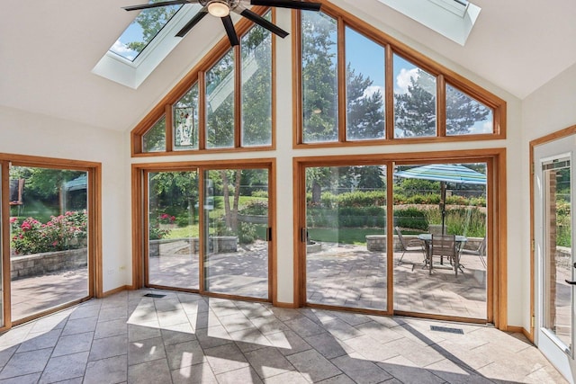 641 Mason Ln, Lake In The Hills, IL 60156 - unfurnished sunroom featuring a skylight, high vaulted ceiling, and stone tile flooring