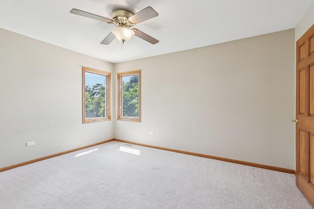 641 Mason Ln, Lake In The Hills, IL 60156 - empty room featuring light carpet and a ceiling fan