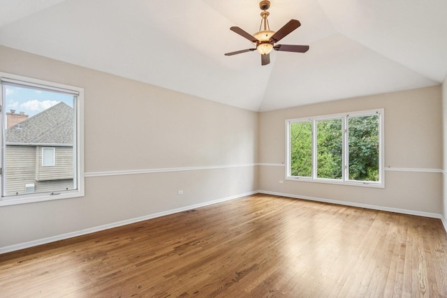 641 Mason Ln, Lake In The Hills, IL 60156 - spare room with vaulted ceiling, wood finished floors, and a ceiling fan