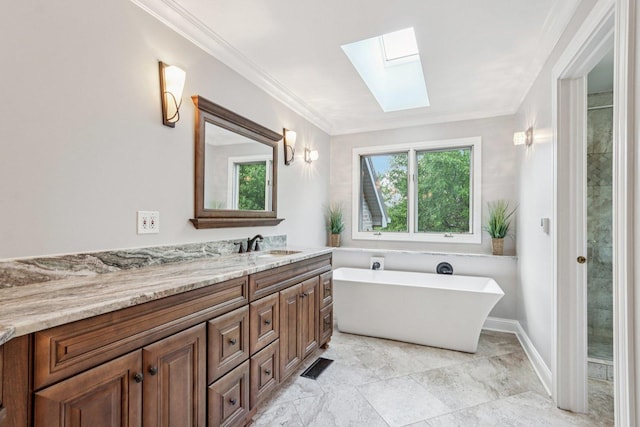 641 Mason Ln, Lake In The Hills, IL 60156 - full bath with a skylight, vanity, a freestanding bath, healthy amount of natural light, and ornamental molding