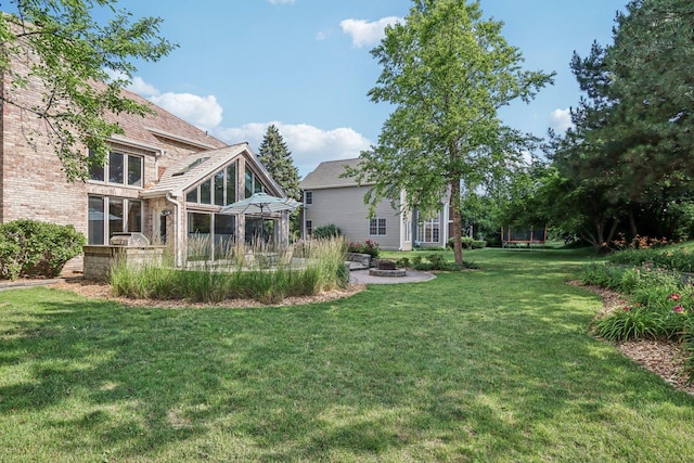641 Mason Ln, Lake In The Hills, IL 60156 - view of grassy yard with a patio and an outdoor fire pit