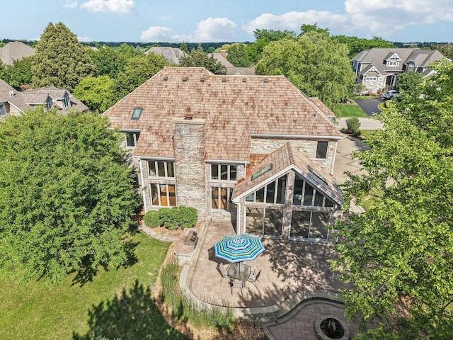 641 Mason Ln, Lake In The Hills, IL 60156 - rear view of house featuring a patio, a sunroom, and a chimney