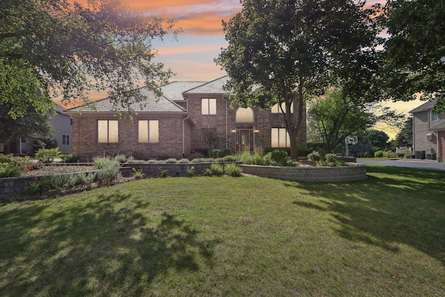 641 Mason Ln, Lake In The Hills, IL 60156 - view of front facade with a front lawn and brick siding