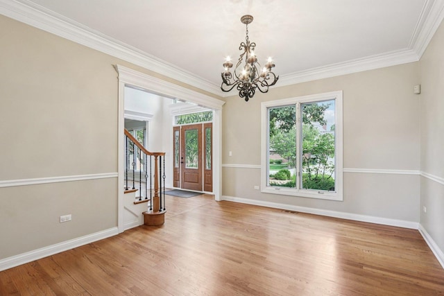 641 Mason Ln, Lake In The Hills, IL 60156 - spare room with a chandelier, stairs, light wood finished floors, and ornamental molding