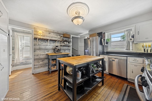 861 Hill Ave, Glen Ellyn, IL 60137 - kitchen featuring appliances with stainless steel finishes, wooden counters, open shelves, wood-type flooring, and wooden walls