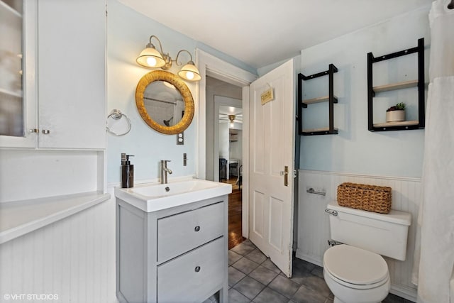 861 Hill Ave, Glen Ellyn, IL 60137 - bathroom featuring wainscoting, vanity, ceiling fan, and tile patterned floors