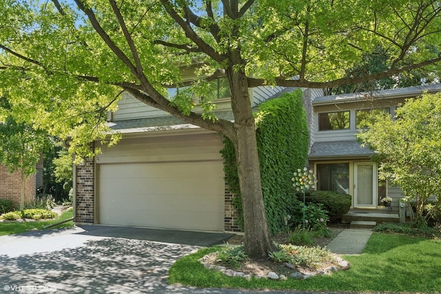 20 Brook Ln, Palos Park, IL 60464 - view of property hidden behind natural elements featuring driveway, brick siding, and an attached garage