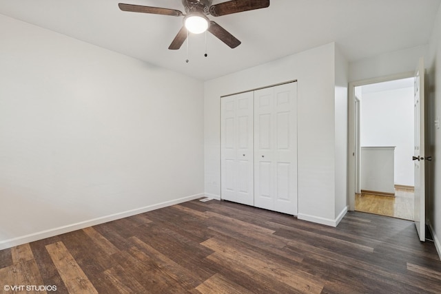 20 Brook Ln, Palos Park, IL 60464 - unfurnished bedroom featuring dark wood-type flooring, a closet, and a ceiling fan