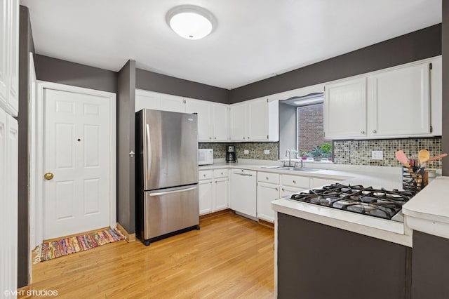 20 Brook Ln, Palos Park, IL 60464 - kitchen with white appliances, light wood-style floors, light countertops, and tasteful backsplash