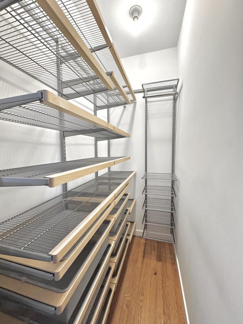 2238 W Winona St, Chicago, IL 60625 - spacious closet featuring wood finished floors