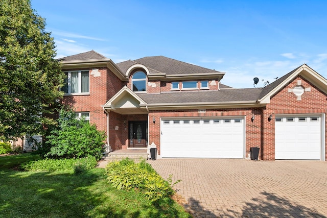 7715 Virginia Ct, Willowbrook, IL 60527 - traditional home with decorative driveway, an attached garage, brick siding, and a shingled roof