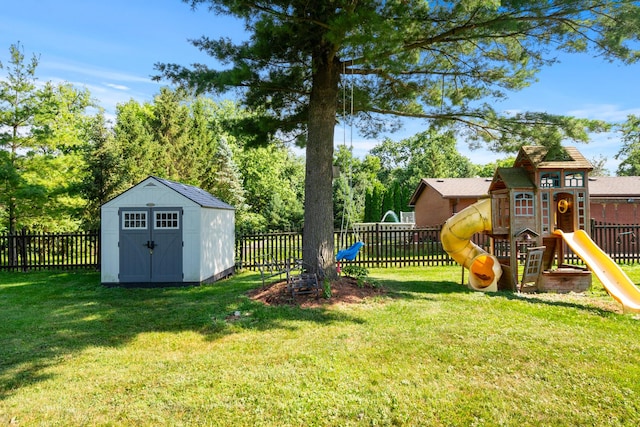 7715 Virginia Ct, Willowbrook, IL 60527 - fenced backyard featuring a playground and a storage unit