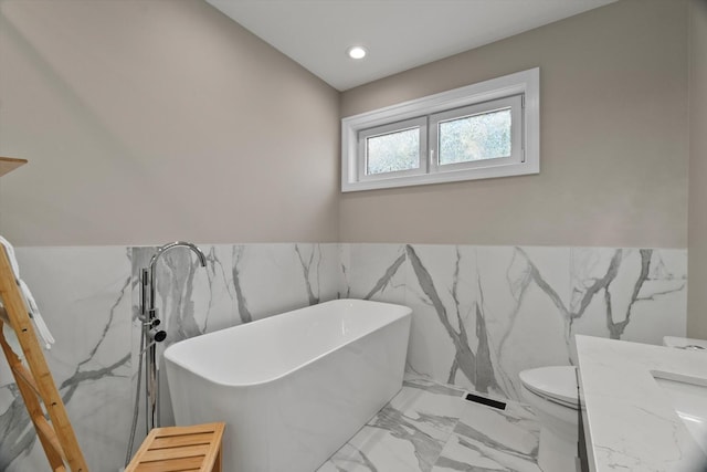 6223 S Ellis Ave, Chicago, IL 60637 - full bathroom featuring tile walls, marble tiled flooring, a freestanding bath, a wainscoted wall, and recessed lighting